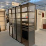 Metal and glass cabinet with hinged door